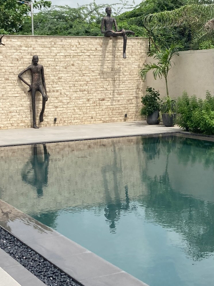 Poolside Figure Sculptures